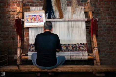 Desya Carpet artisan as seen by Mohamed Ayman.
